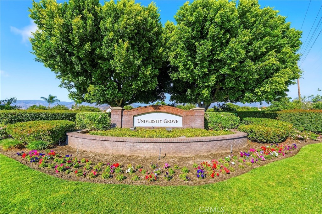 1663 Naranjo Court Redlands, CA 92374 - Photo 59 of 59 a sign that is sitting in the grass next to a road