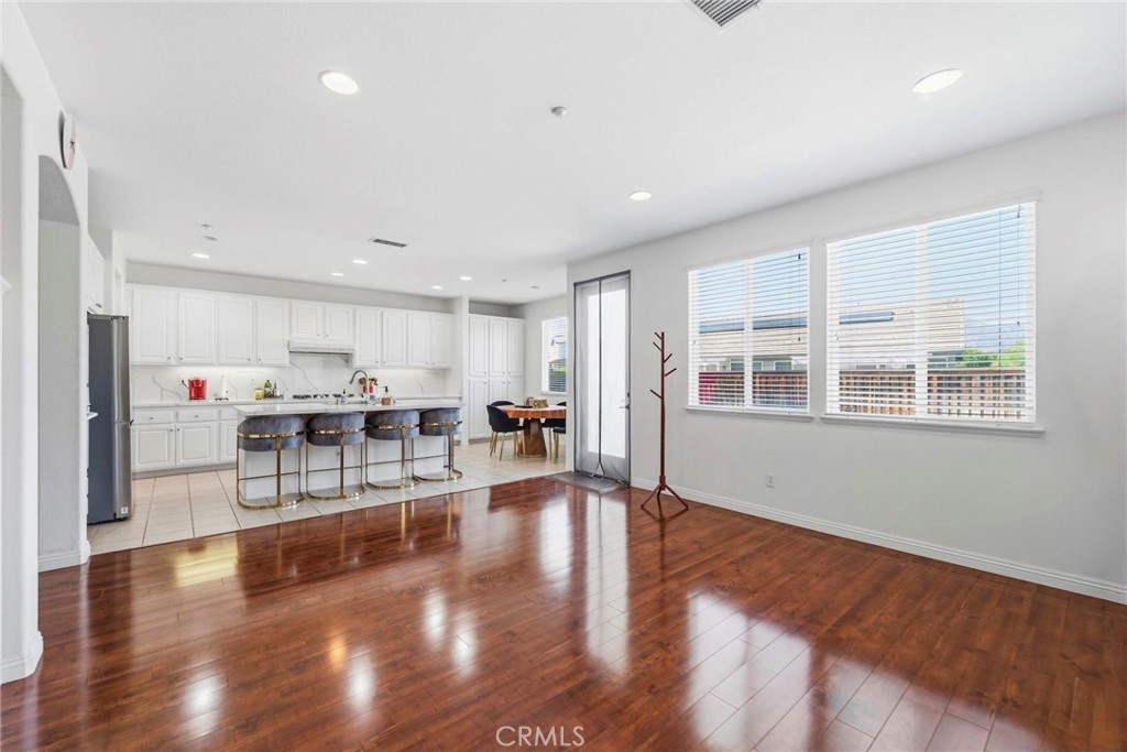 1663 Naranjo Court Redlands, CA 92374 - Photo 10 of 59 a living room with furniture and kitchen view with wooden floor