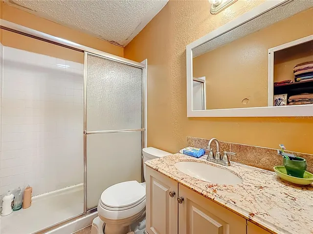 a bedroom with bed and a window