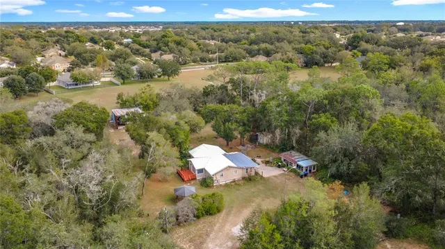 an aerial view of residential house with outdoor space