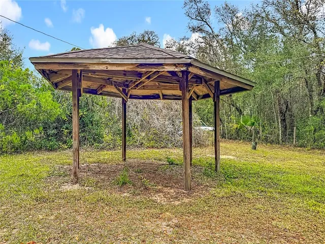 a view of a deck with a table and chairs