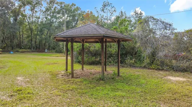 a view of a backyard of the house