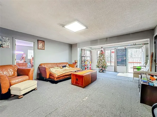 a bedroom with a bed and dresser in it