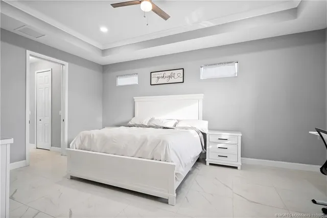 a bedroom with a bed and a night stand