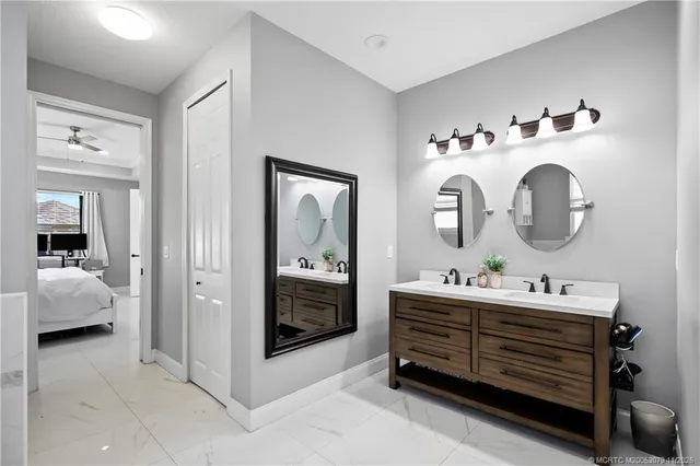 a room with a baby crib and dresser