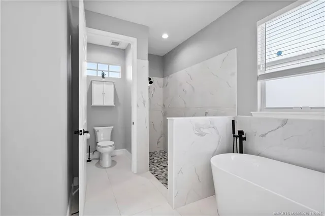 a bathroom with a bathtub and window