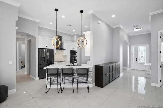 a kitchen with a sink cabinets and window
