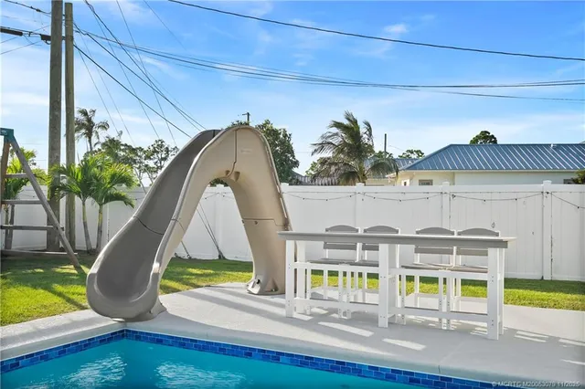 a room with furniture and a swimming pool