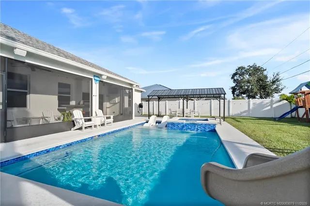 a view of a swimming pool with a patio