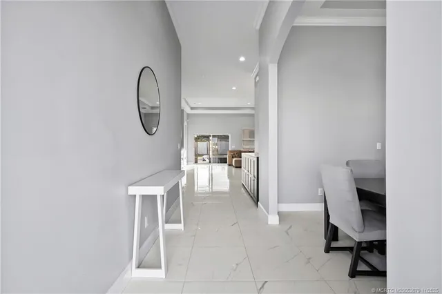 a dining room with furniture and a window