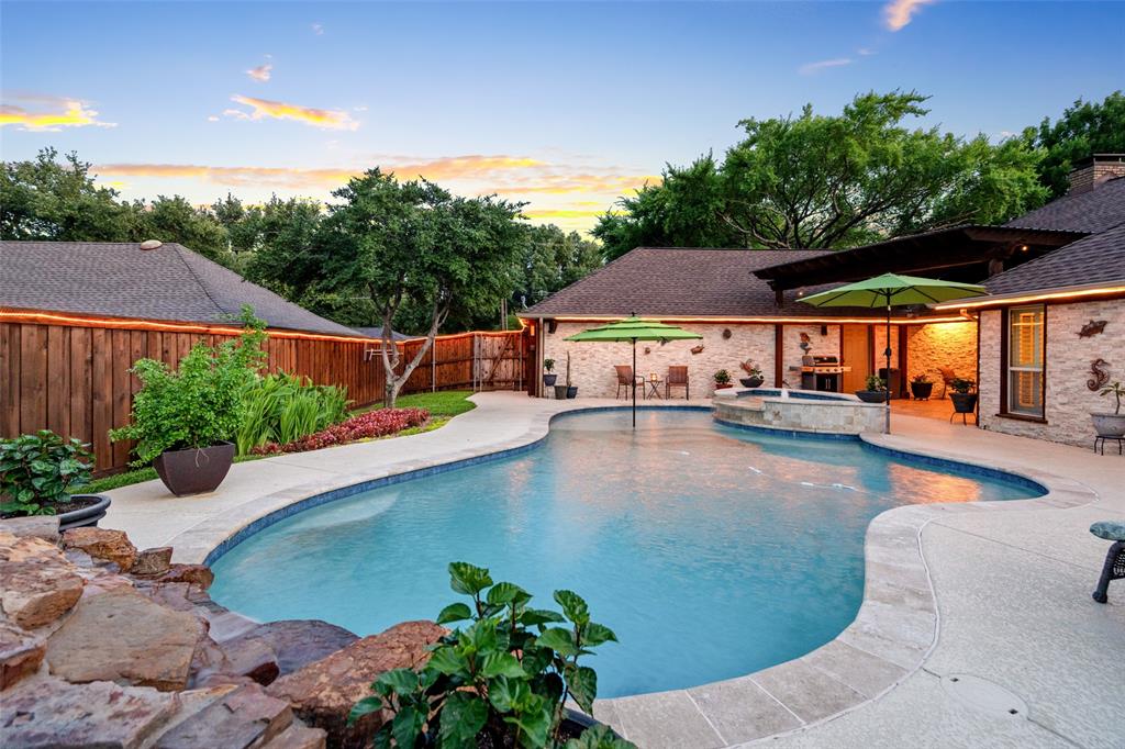 400 Hunters Ridge Circle Coppell, TX 75019 - Photo 26 of 35 an outdoor space with pool and furniture