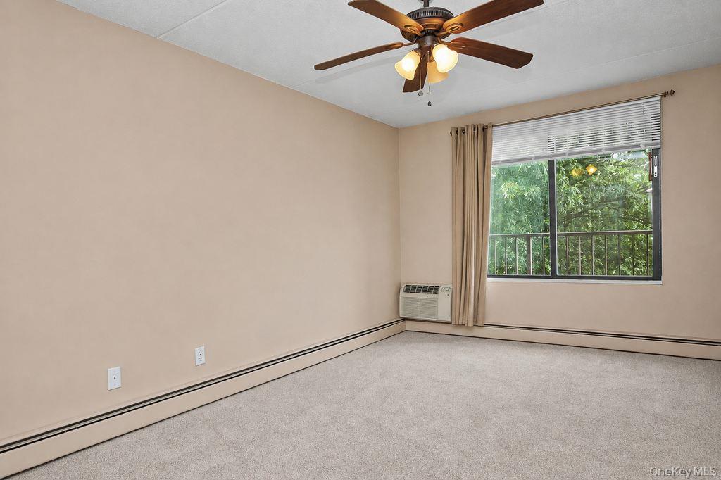 150 Overlook, Unit 5F Peekskill, NY 10566 - Photo 13 of 47 A sensational bedroom with brand new carpeting, a delightful ceiling fan for supreme air circulation. Great nature views