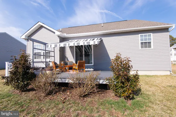 a front view of house with yard and seating space