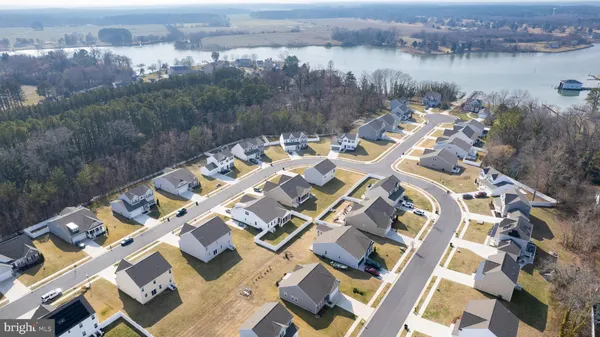 aerial view of a house with a lake view