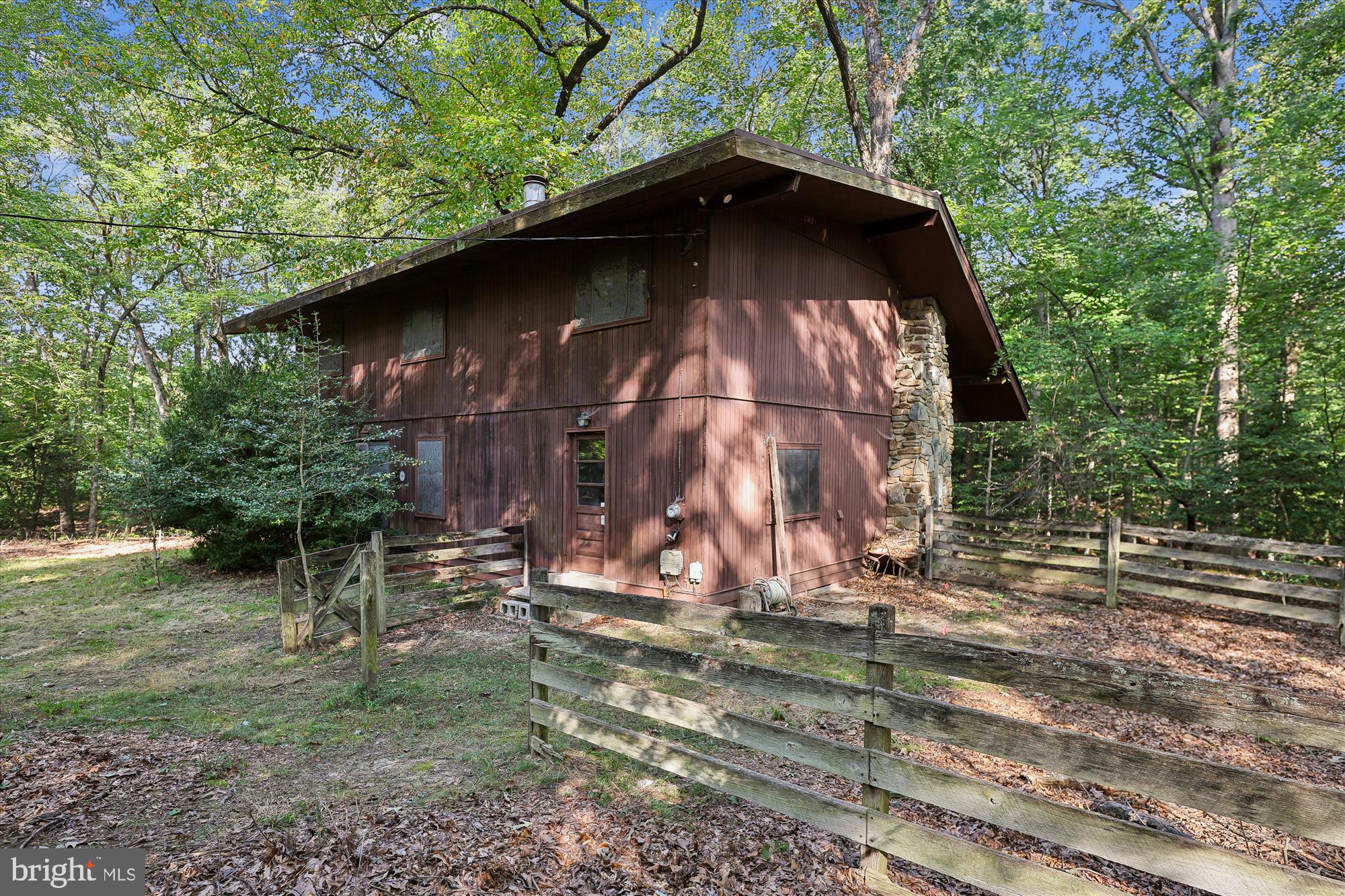 15120 Reserve Road Accokeek, MD 20607 - Photo 1 of 32 a view of a wooden house with a yard