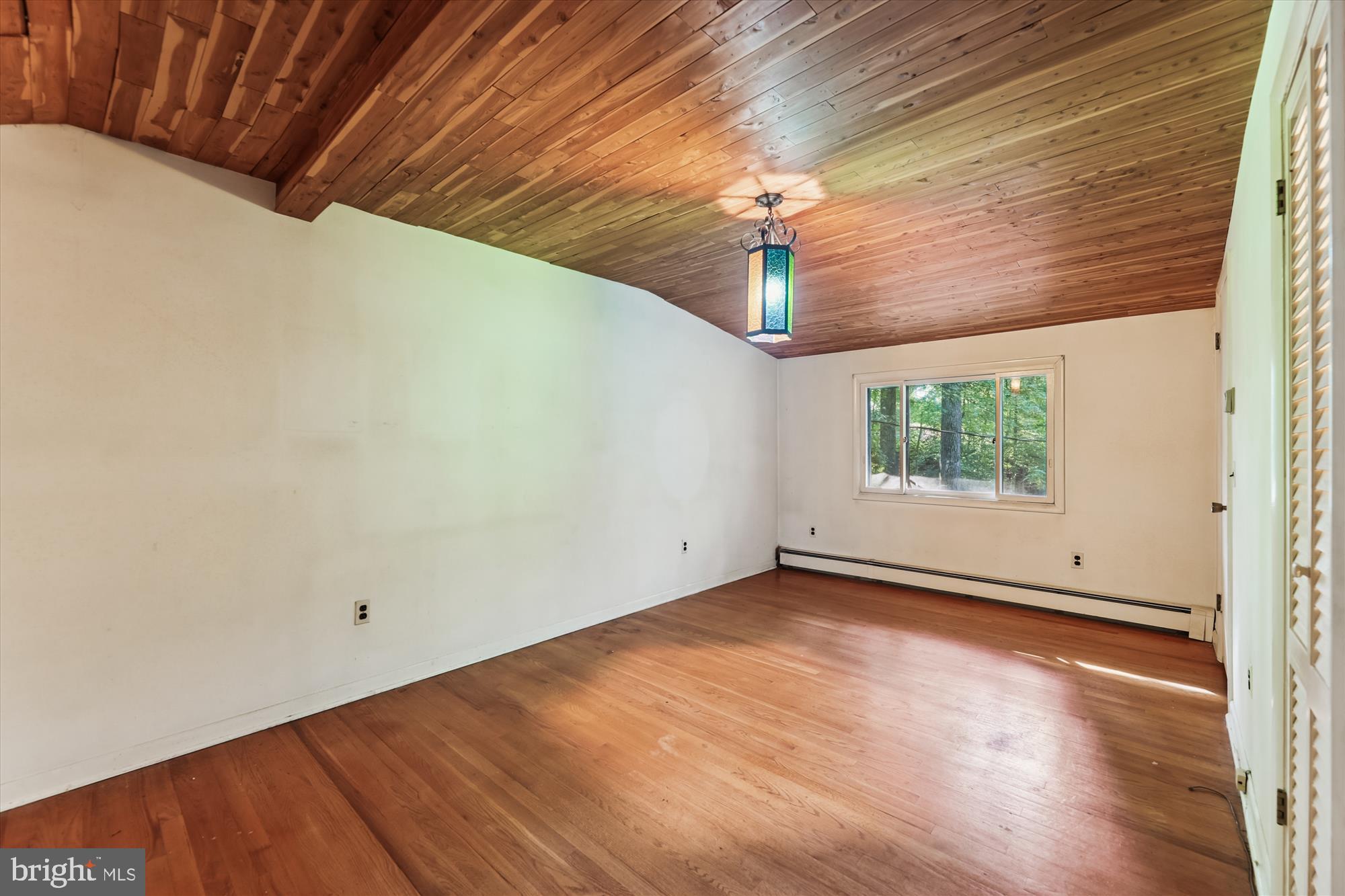 15120 Reserve Road Accokeek, MD 20607 - Photo 17 of 32 a view of empty room with wooden floor and fan