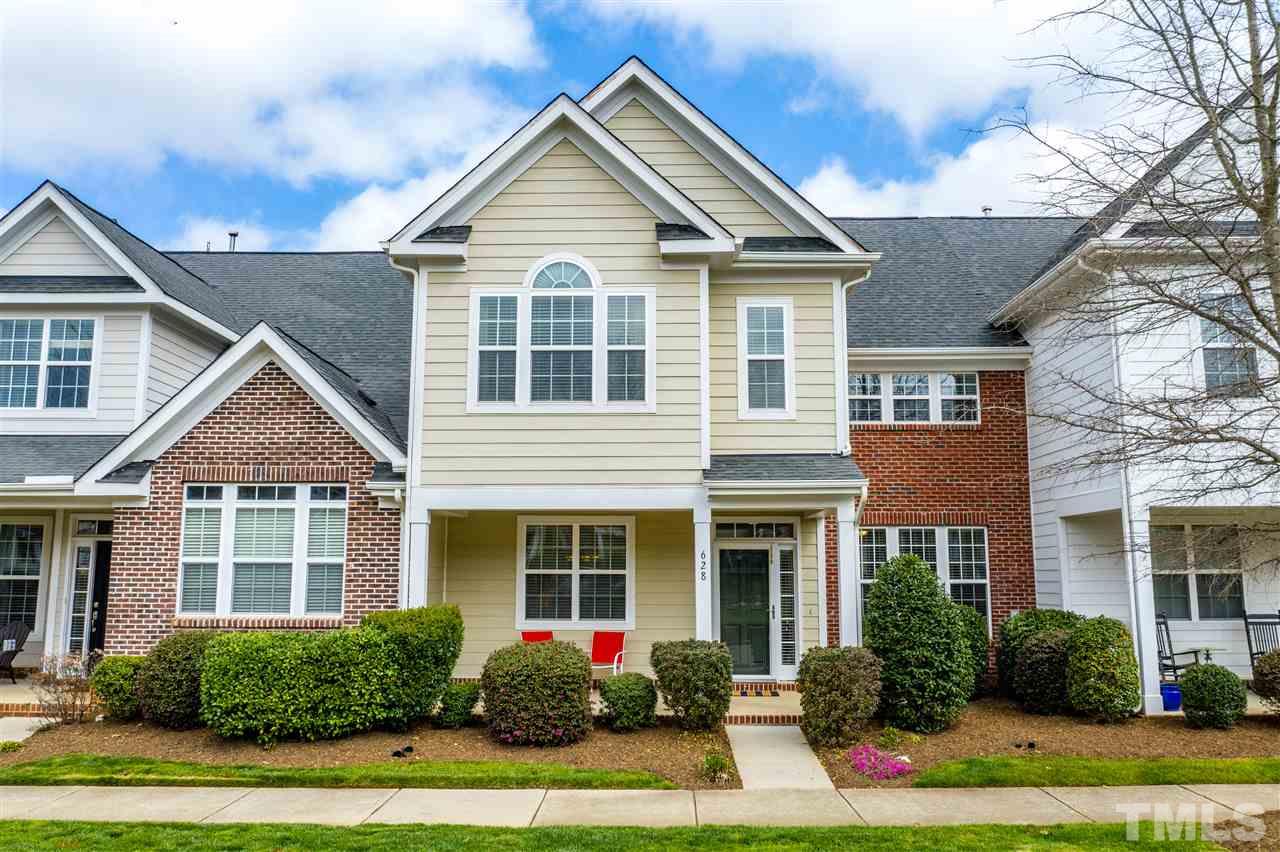 628 Democracy Street Raleigh, NC 27603 - Photo 1 of 26 a front view of a house with yard and green space