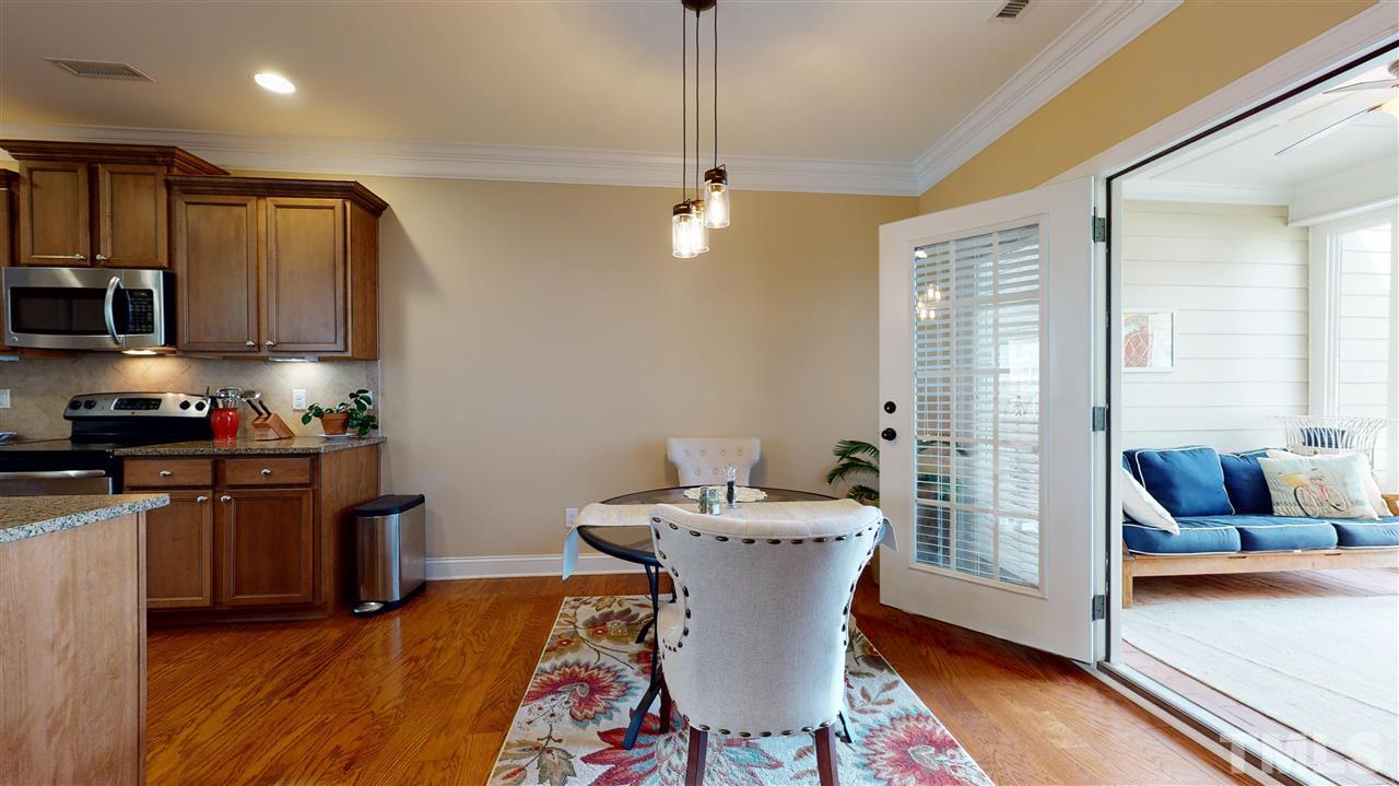 628 Democracy Street Raleigh, NC 27603 - Photo 11 of 26 a living room with furniture and a wooden floor