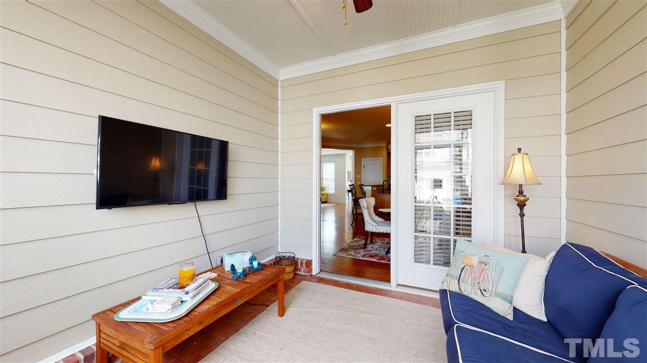 628 Democracy Street Raleigh, NC 27603 - Photo 12 of 26 a living room with furniture and a flat screen tv