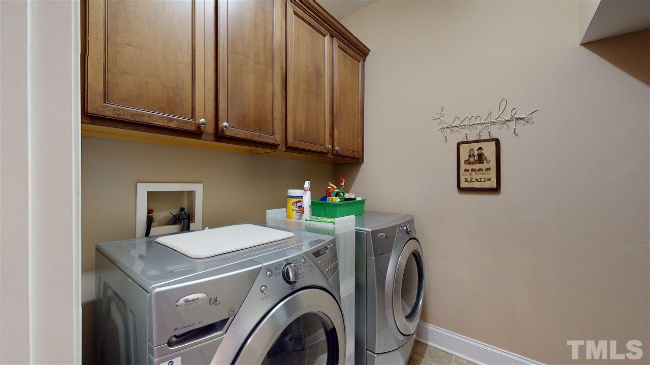 628 Democracy Street Raleigh, NC 27603 - Photo 14 of 26 a utility room with dryer and washer