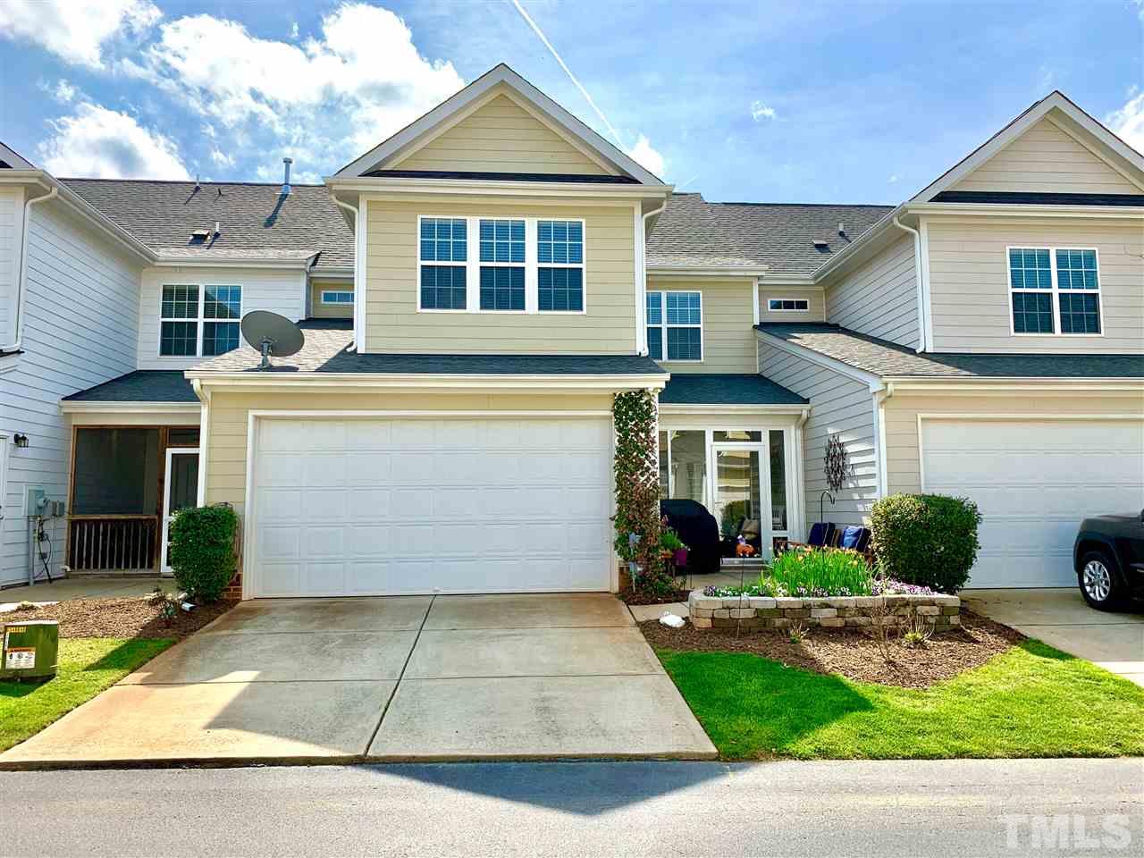 628 Democracy Street Raleigh, NC 27603 - Photo 23 of 26 a front view of a house with garden