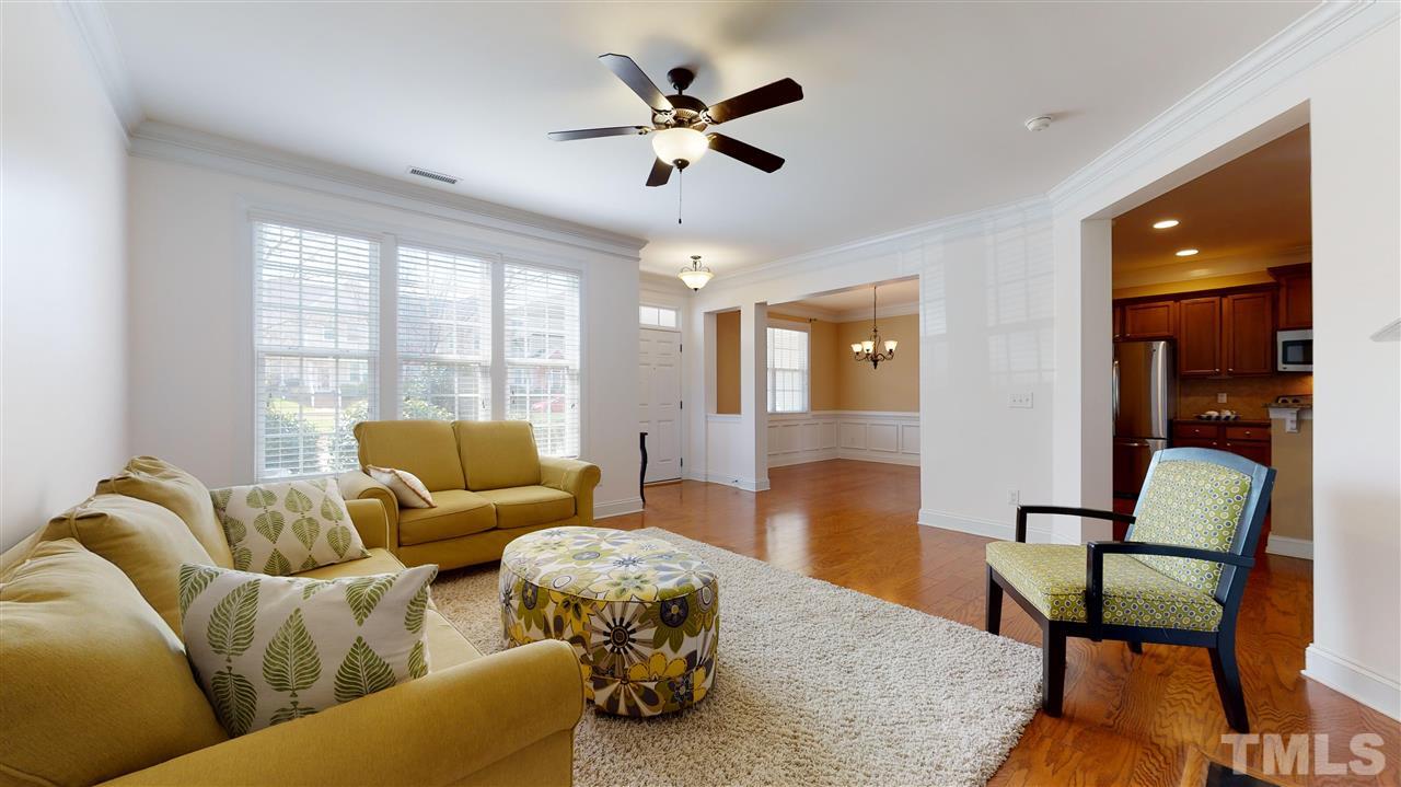 628 Democracy Street Raleigh, NC 27603 - Photo 5 of 26 a living room with furniture and a window