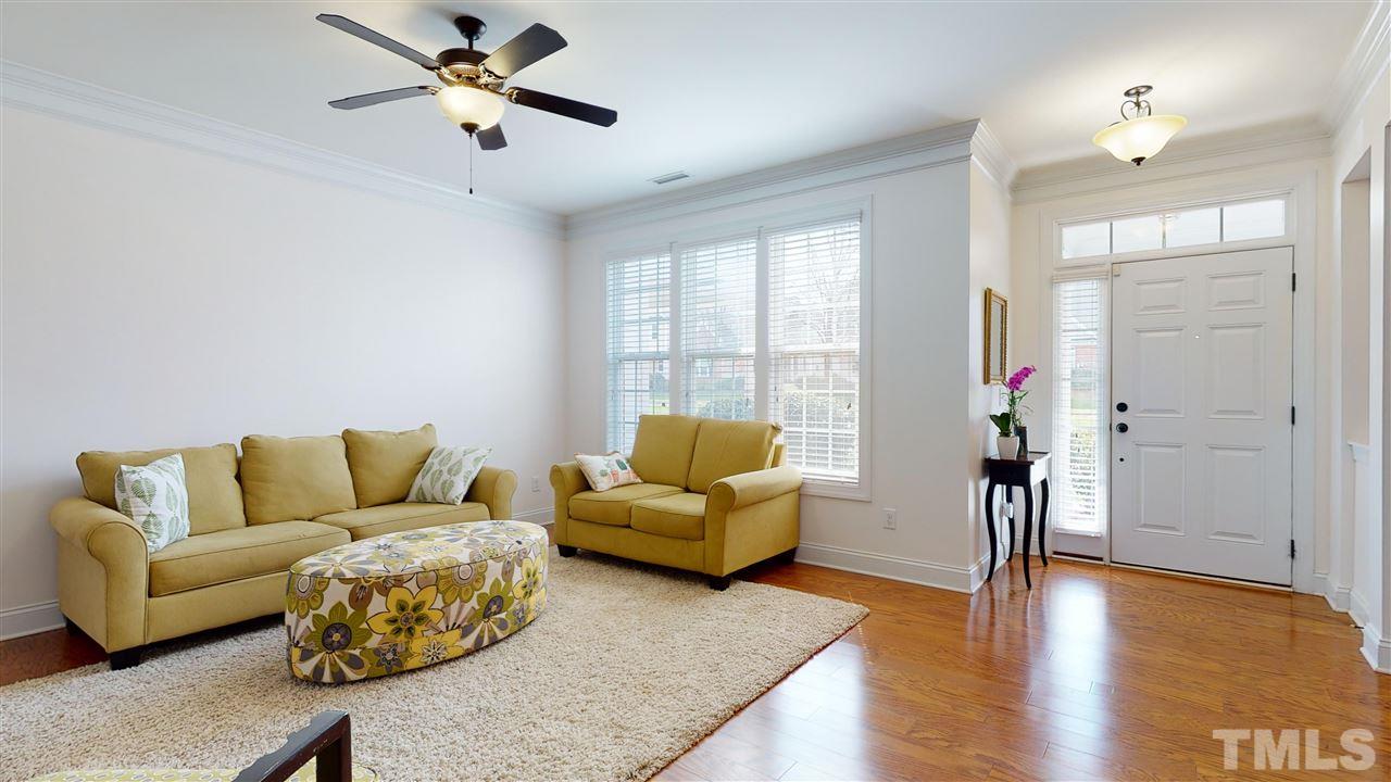 628 Democracy Street Raleigh, NC 27603 - Photo 6 of 26 a living room with furniture and a window