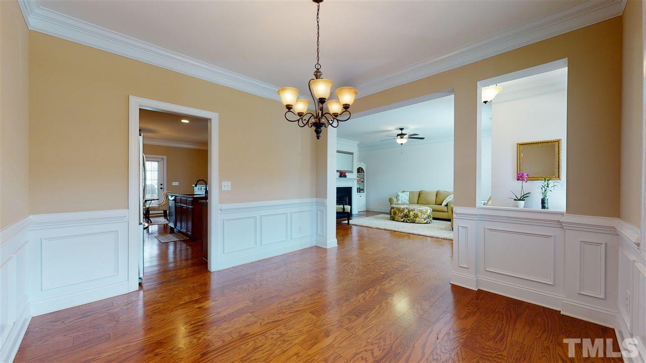 628 Democracy Street Raleigh, NC 27603 - Photo 7 of 26 a view of a living room and wooden floor