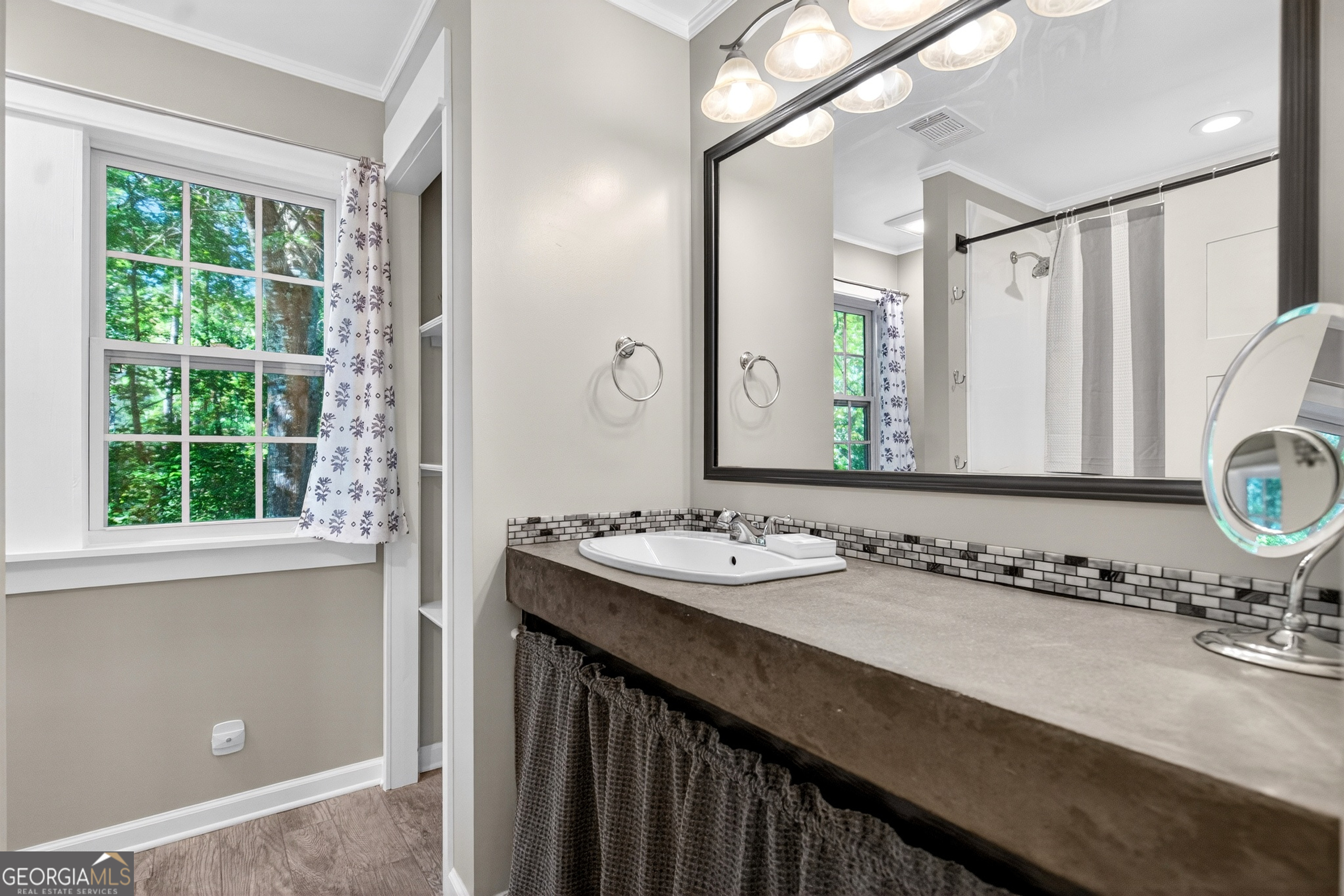 4656 Greenville Road LaGrange, GA 30241 - Photo 23 of 34 a bathroom with a sink and a mirror