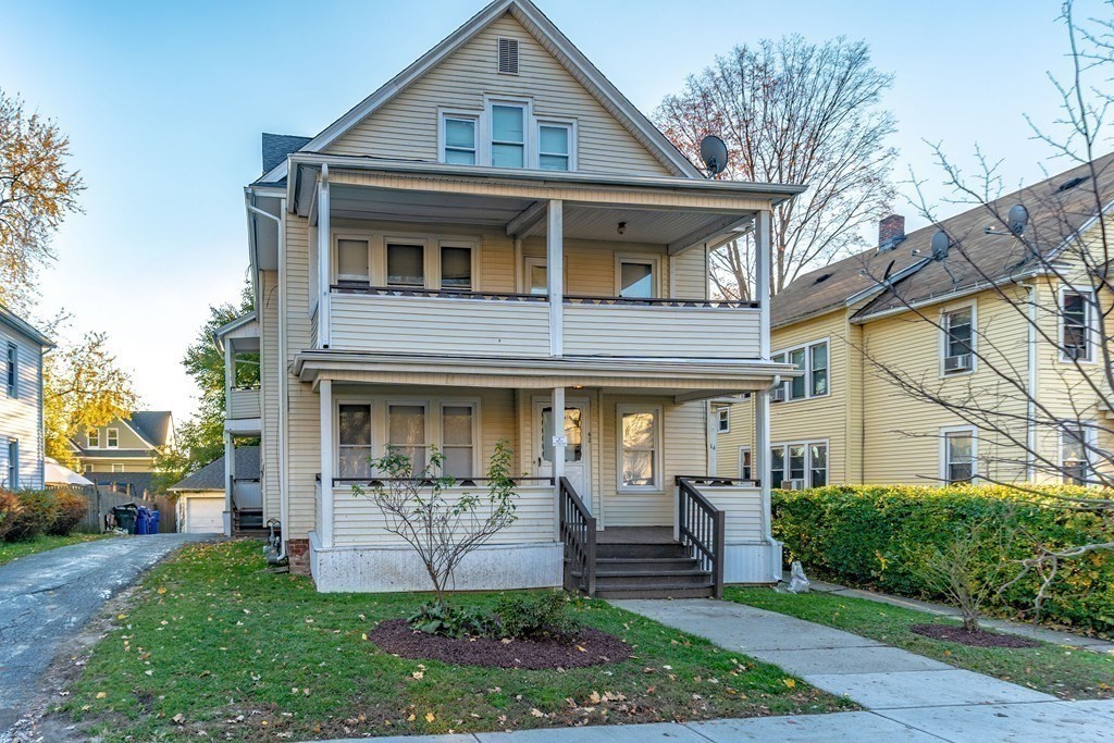 a front view of a house with garden