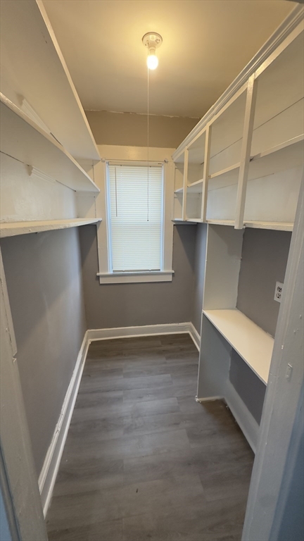 42-44 Narragansett Street, Unit 1 Springfield, MA 01107 - Photo 4 of 10 a view of an empty room with wooden floor and a window