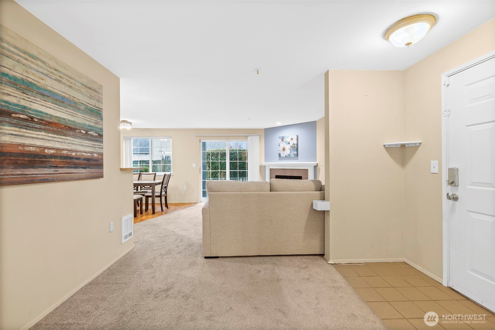 10824 Southeast 170th Street, Unit B103 Renton, WA 98055 - Photo 11 of 31 a living room with furniture and a table