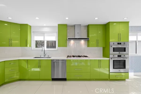 a kitchen with a sink cabinets and a stove