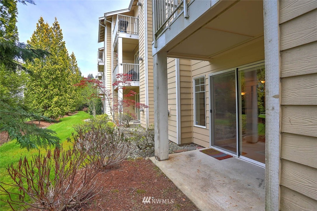 15150 140th Way Southeast, Unit N102 Renton, WA 98058 - Photo 14 of 20 a view of a house with a backyard