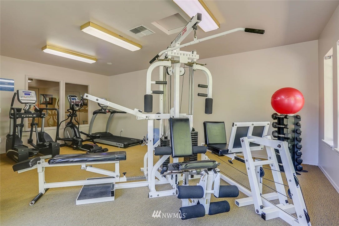 15150 140th Way Southeast, Unit N102 Renton, WA 98058 - Photo 16 of 20 a view of a room with gym equipment