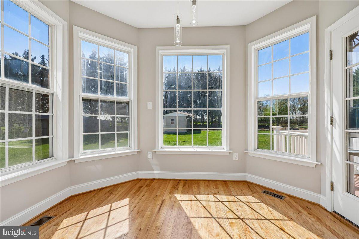 21712 Slidell Road Boyds, MD 20841 - Photo 11 of 32 a view of an empty room with a window and a tub