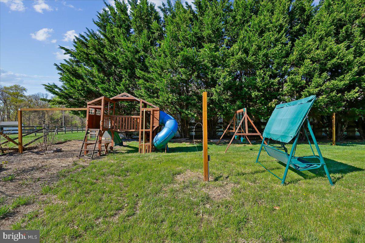 21712 Slidell Road Boyds, MD 20841 - Photo 26 of 32 a view of a house with backyard and a slide