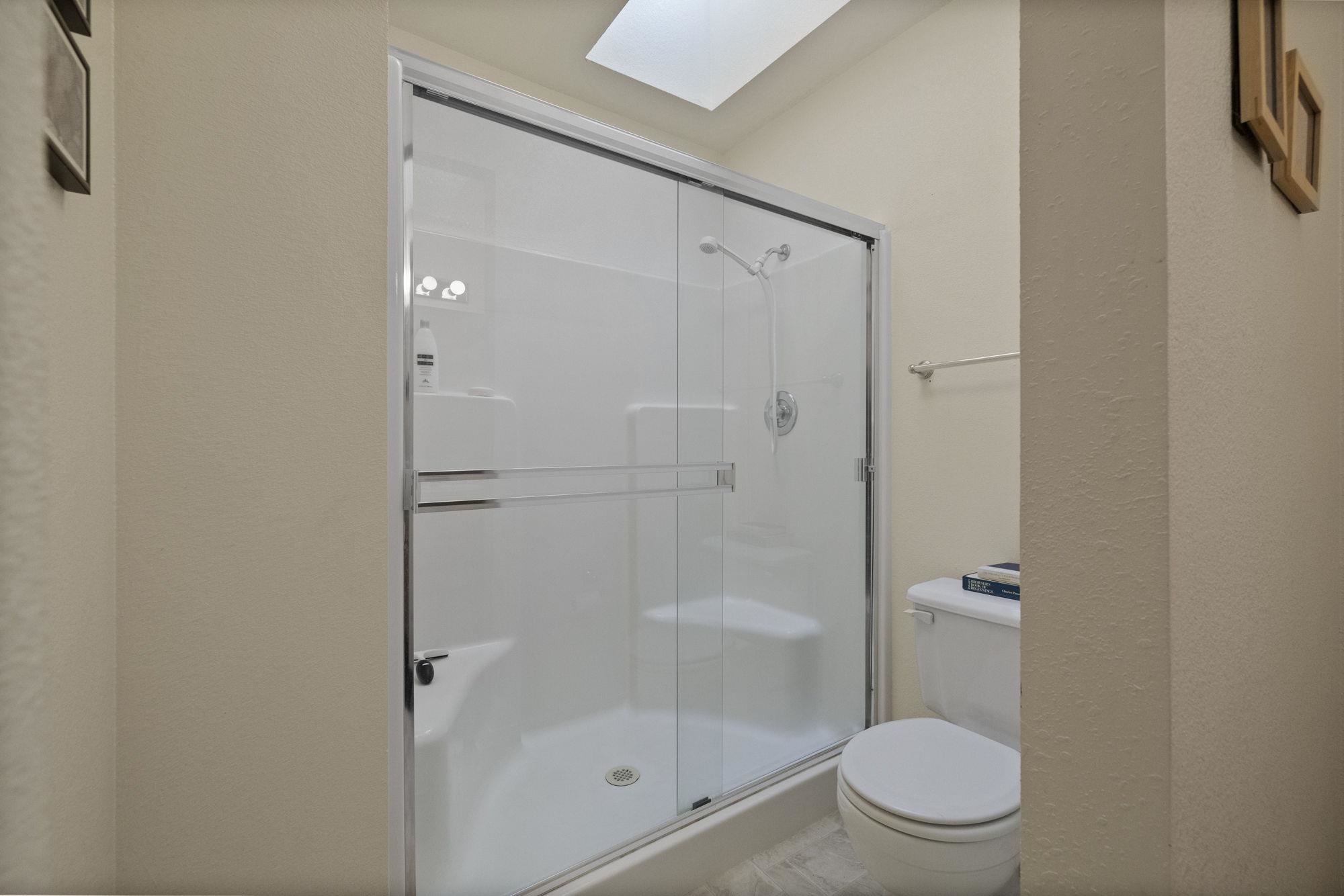 19099 Raboul Court Groveland, CA 95321 - Photo 19 of 58 a white toilet sitting next to a bathroom sink