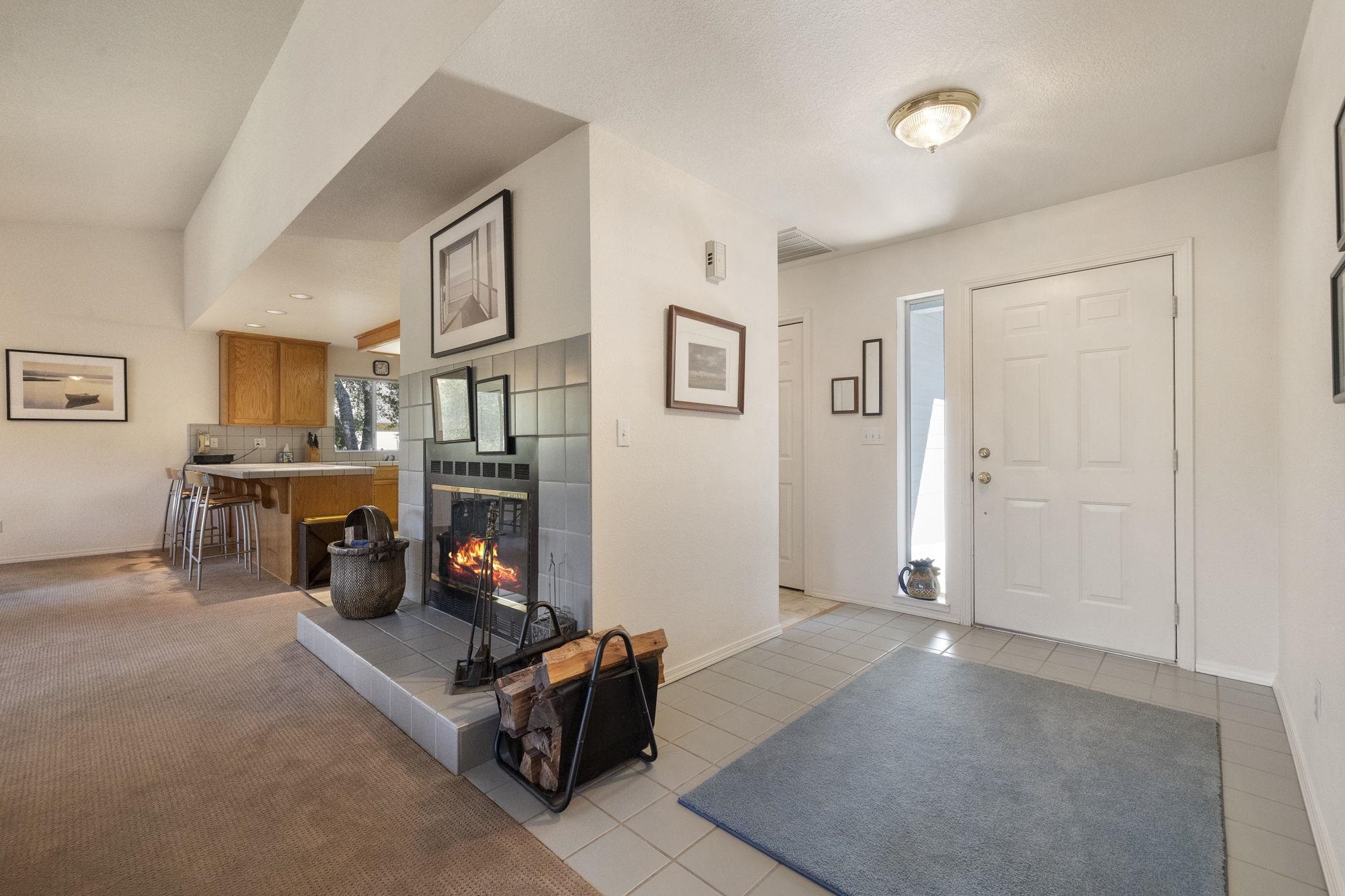 19099 Raboul Court Groveland, CA 95321 - Photo 5 of 58 a living room with furniture gym equipment and a fireplace