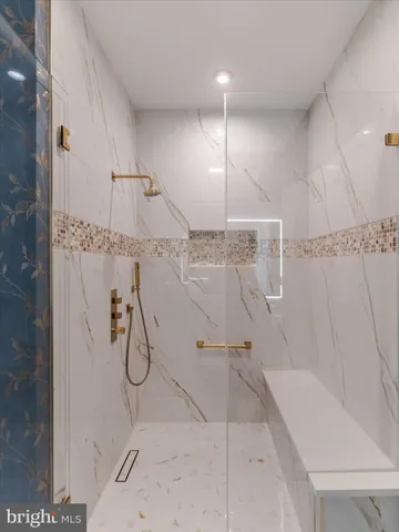 a bathroom with a shower and a shower