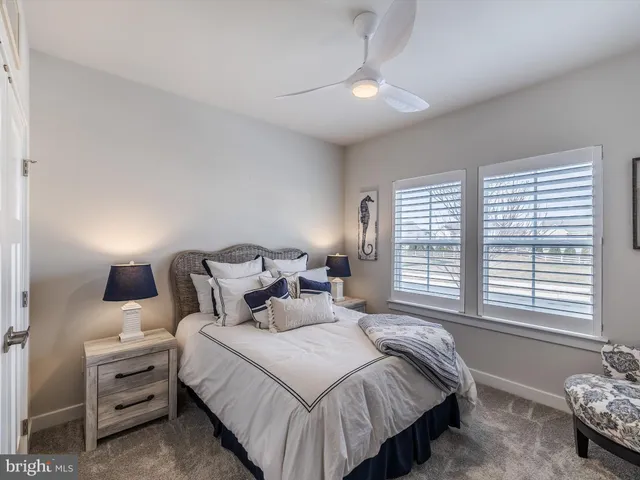 a bed room with a bed and a window