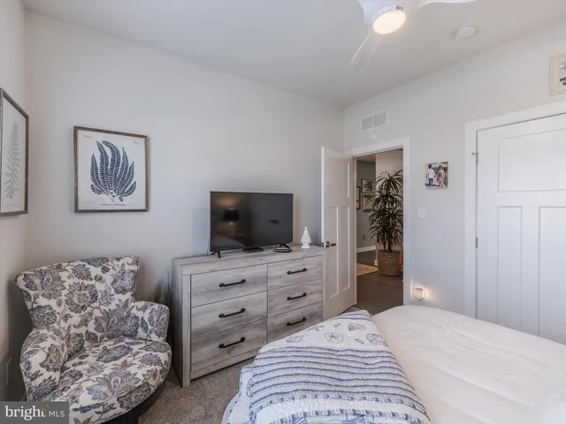 a bedroom with a bed and furniture