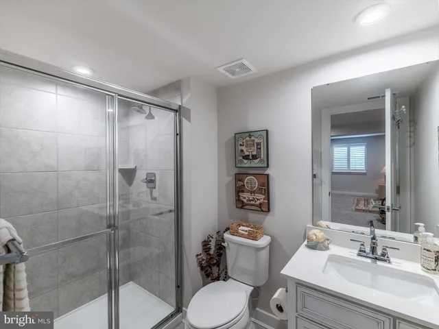 a bathroom with a toilet sink and shower