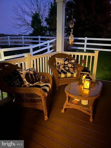 a view of a balcony with chairs