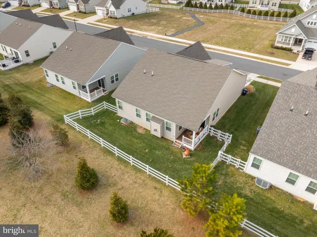 a view of swimming pool with a yard and large tree