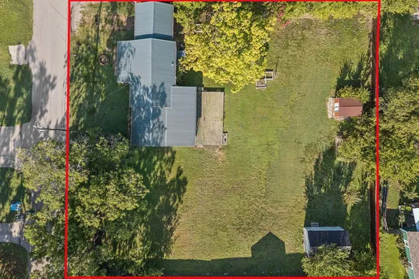 a aerial view of a house with a yard