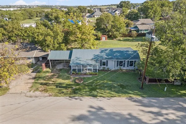 a aerial view of a house with a yard