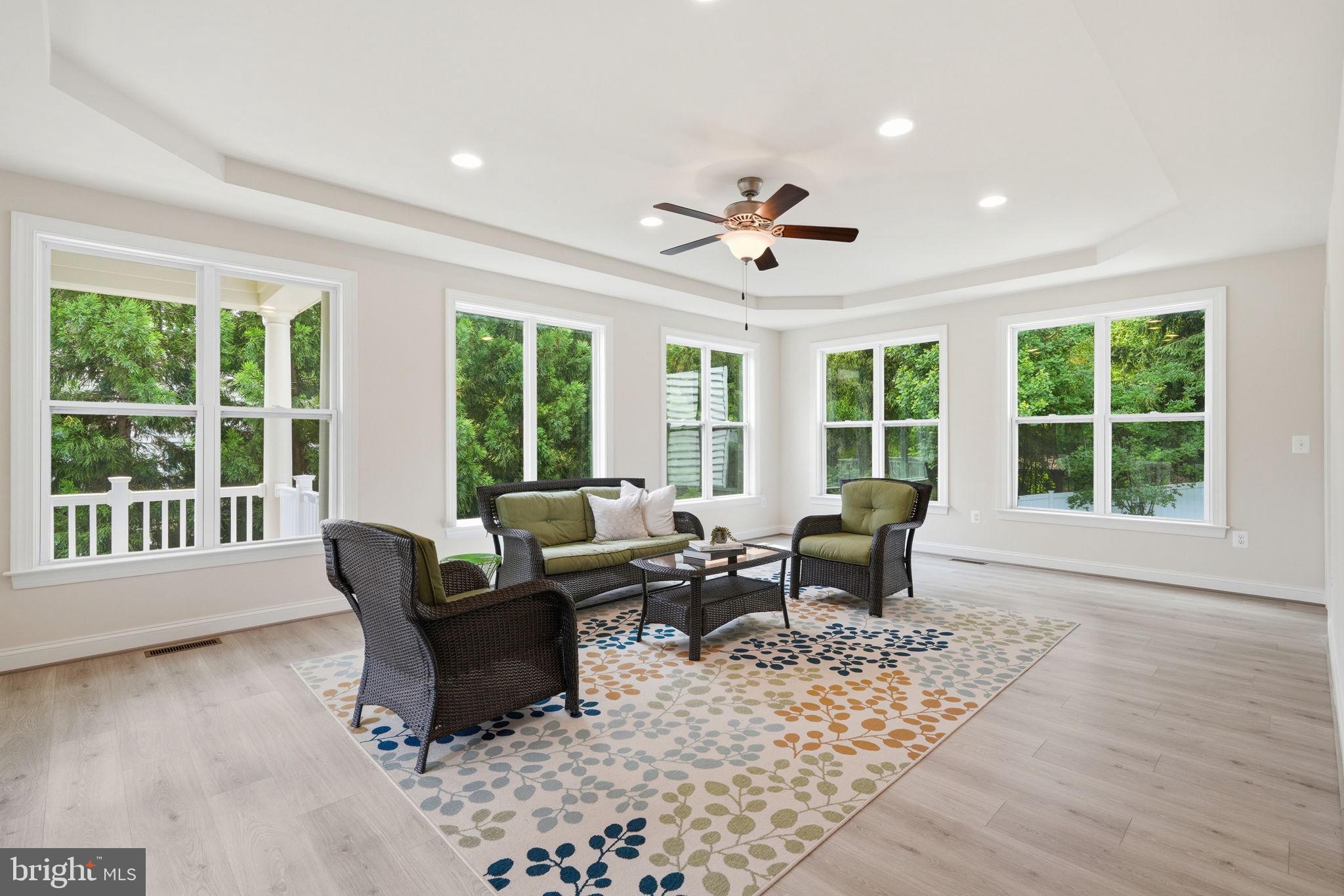 7821 Old Falls Road McLean, VA 22102 - Photo 9 of 62 a living room with furniture and large windows