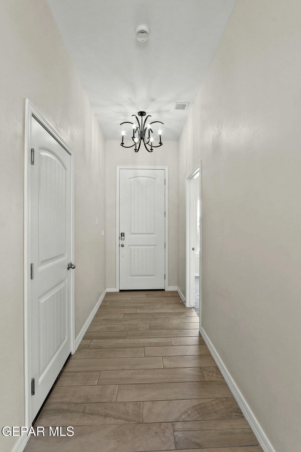 3872 Object Place El Paso, TX 79938 - Photo 15 of 33 a view of a hallway with wooden floor