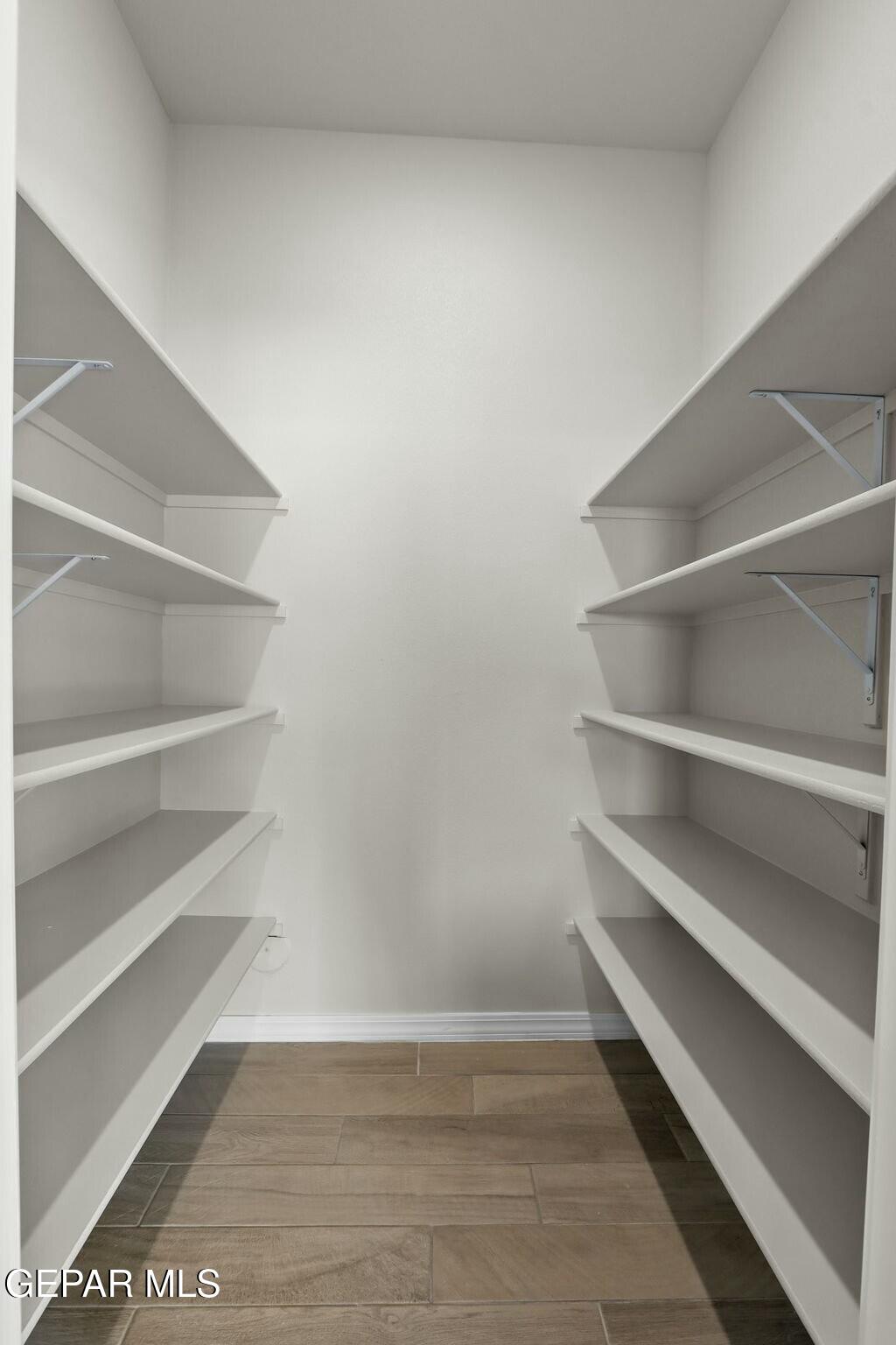 3872 Object Place El Paso, TX 79938 - Photo 18 of 33 a view of walk in closet with empty racks